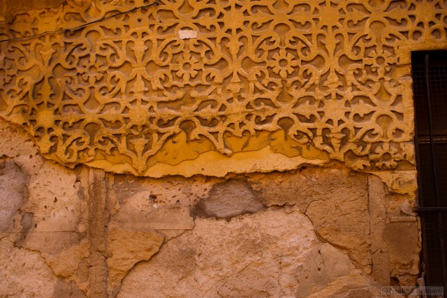 Old wall pattern, the material looks and feels like reconstituted sandstone.